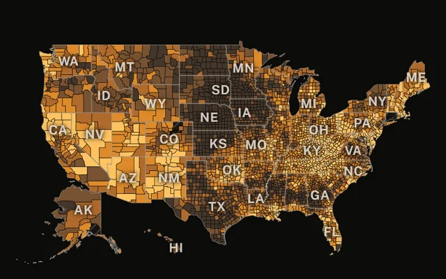 The whole country at county level in ember tones, with a legend and a provisional panel giving the latest 12-month national overdose count